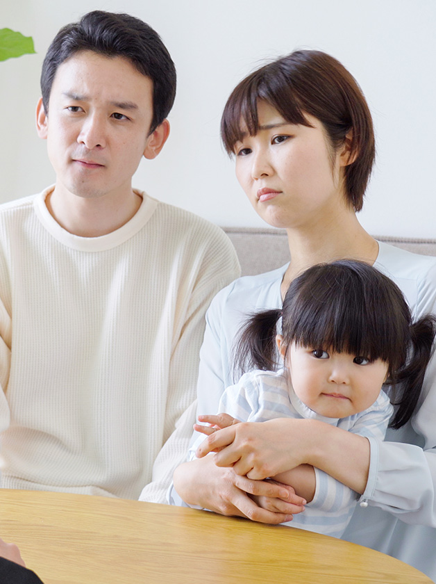 Photo of a family counselling session with mother, father and daughter